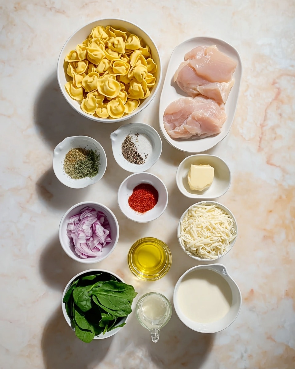 The image shows an overhead view of several small white bowls and cups arranged neatly on a white marbled surface. At the top, a bowl contains yellow tortellini with a smooth, slightly shiny texture. To its right, a bowl holds two thin, pale pink pieces of raw chicken. Below, a small bowl holds colorful spices in red, white, and gray shades, divided into sections. Next to it, another small white bowl contains golden oil, and beside it, a small glass cup with minced garlic. Moving downward, a small bowl holds bright green spinach leaves with a fresh look, and beside it, chopped red onions in another white bowl. Below are two white dishes with finely grated white cheeses, one with a fine texture and the other coarser. A glass cup with a small piece of yellow butter sits next to a small bowl filled with crushed black pepper. Finally, a white measuring cup contains cream, smooth and off-white in color. The whole setup is clean, bright, and well-organized, showcasing raw ingredients for cooking. photo taken with an iphone --ar 4:5 --v 7