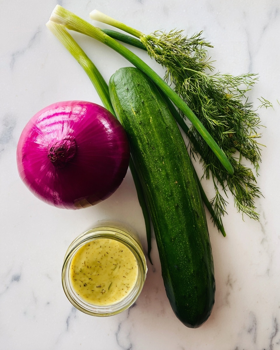 A fresh green cucumber lies horizontally next to bright green dill sprigs that add a feathery texture on the right side. Above the cucumber are three green stalks pointing diagonally upward. On the left side, there is a round purple onion with shiny skin showing some light reflections. Below the onion is a small clear glass jar filled with thick yellow sauce with visible herbs inside. All ingredients are placed on a white marbled surface. photo taken with an iphone --ar 4:5 --v 7