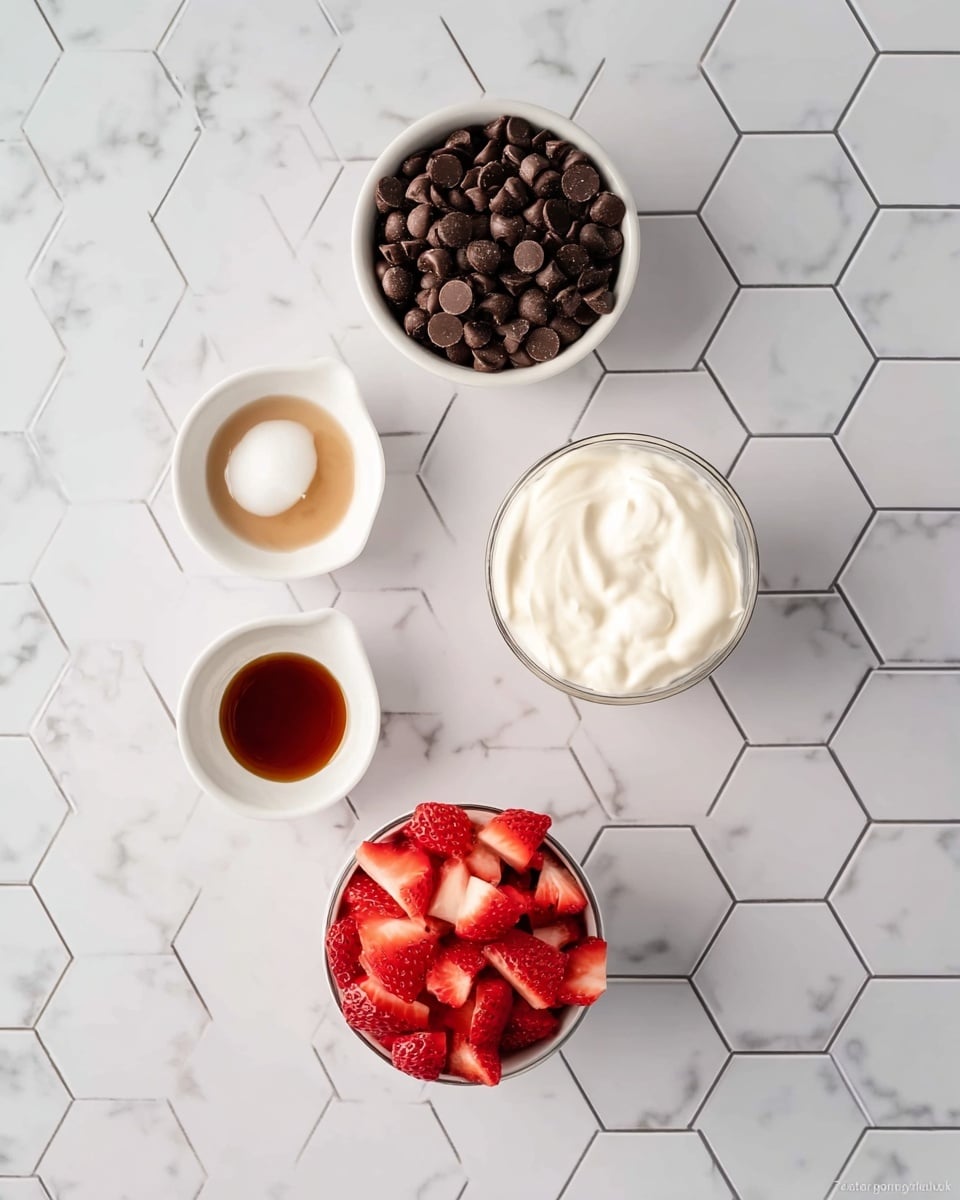 The image shows five small white bowls and two white measuring cups placed on a white marbled hexagon tile surface. Starting from the top, there is a round white bowl filled with dark brown chocolate chips. Below it, slightly to the left, is a small white bowl with a white solid ingredient, likely coconut oil. To the right of that is another small white bowl with a dark brown liquid, possibly vanilla extract. Below and to the left is a small white bowl with a light brown liquid, possibly honey or syrup. On the bottom right, a white measuring cup is filled with chopped red strawberries. To the upper right of this is another white measuring cup filled with a thick white cream or yogurt. The image is clean and simple with a bright and fresh look, photo taken with an iphone --ar 4:5 --v 7