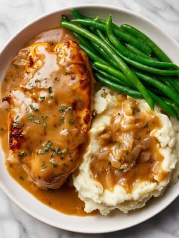Smothered Chicken with Rich Garlic Onion Gravy Recipe