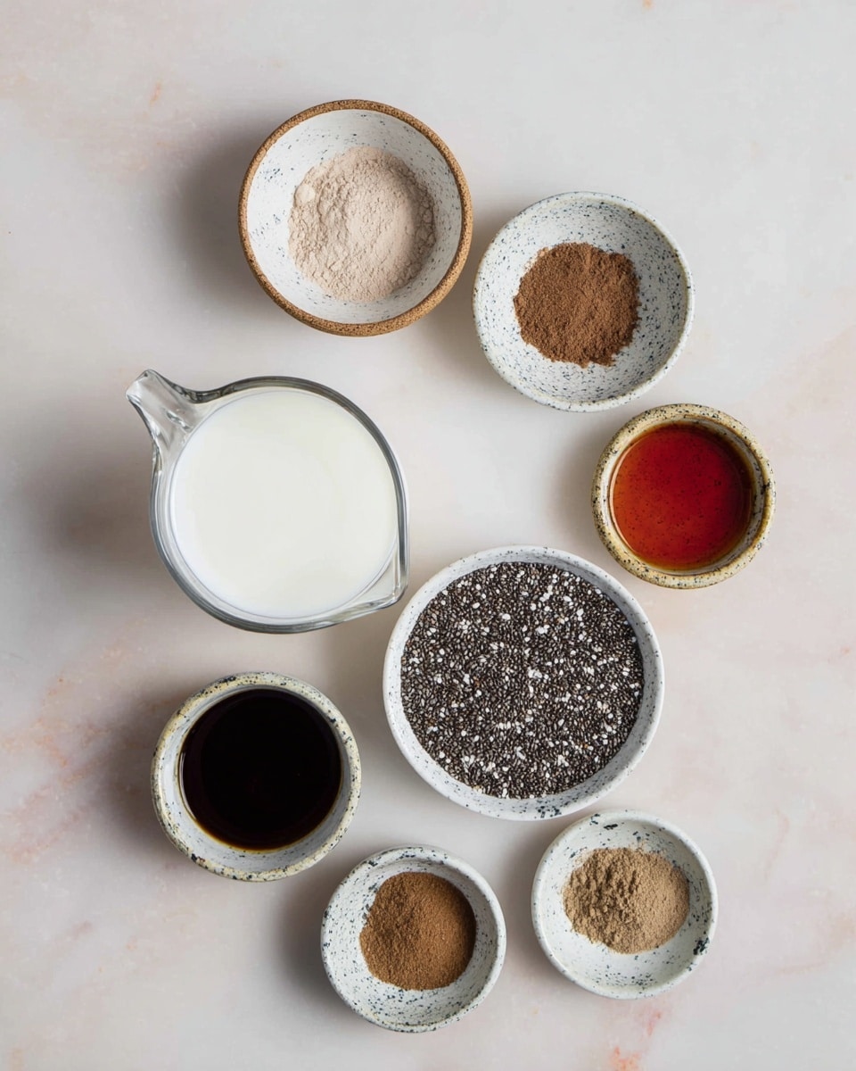 A top view of an arrangement of small white ceramic bowls filled with various ingredients, placed on a white marbled surface. From top to bottom, starting on the upper left, there is a shallow bowl with light brown powder, below it a bowl with medium brown powder, then a bowl with reddish-brown liquid. Centered below these is a larger bowl filled with tiny round black and white chia seeds. To the right of the chia seeds is a clear glass measuring cup filled with white liquid, likely milk. At the bottom left, there is a small bowl with dark brown liquid, next to it a bowl with thick dark syrup, and near the bottom two smaller bowls contain fine light and medium brown powders. All bowls have a speckled design on them, creating a rustic look. photo taken with an iphone --ar 4:5 --v 7