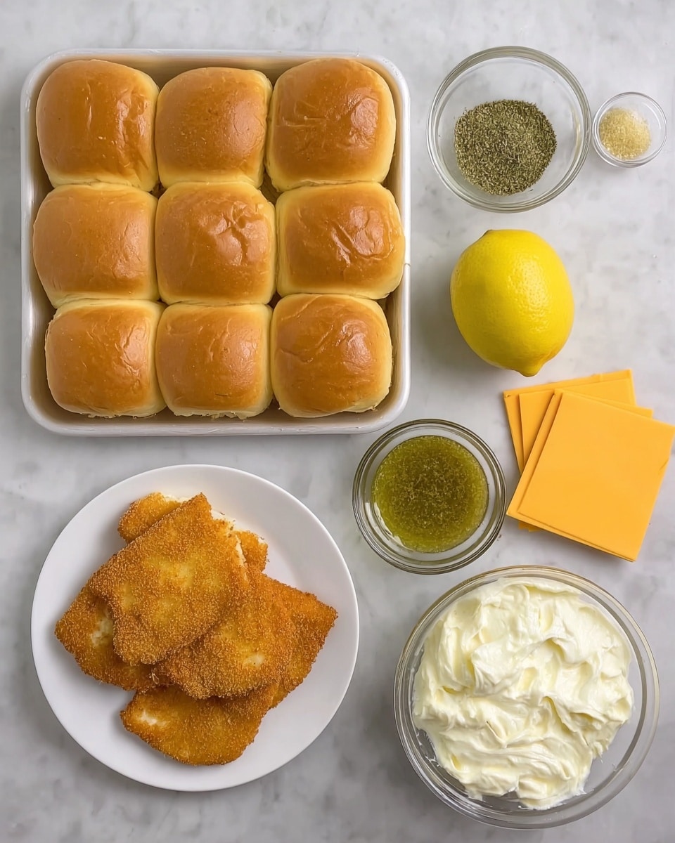 The image shows a white rectangular tray on the top left filled with twelve soft, golden brown slider buns arranged in three rows of four, all slightly wrinkled on top. To the right of the tray is a whole lemon, bright yellow and smooth. Around the lemon are three small clear bowls: the top bowl contains a green herb spice, the middle bowl has a pale yellow liquid, and the bottom bowl is filled with a green chunky sauce. On the bottom left, there is a white round plate with four golden brown breaded fish fillets, each with a crispy texture. In the center bottom is a small stack of individually wrapped bright yellow American cheese slices. On the bottom right, a clear bowl holds a thick, creamy white mixture with a slightly lumpy texture. The background is a white marbled surface. photo taken with an iphone --ar 4:5 --v 7
