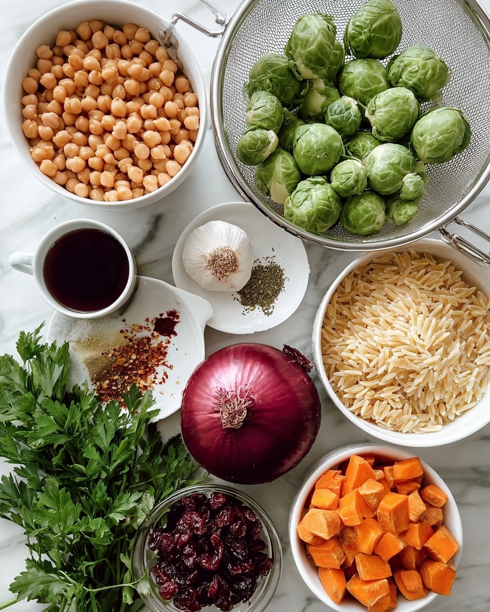 The image shows several ingredients neatly arranged on a white marbled surface. There is a white bowl filled with light brown chickpeas on the left. Next to it, a metal colander holds fresh green Brussels sprouts. Below, a whole white garlic bulb sits centrally. A small black and white cup with dark red liquid is on the left next to a white plate with mixed dried herbs and chili flakes. Below that is a bunch of fresh green parsley. A large red onion with deep purple skin rests near the bottom left, and a white bowl filled with pale yellow orzo pasta sits in the center. Near the top right, a small white bowl contains dark red dried cranberries, and next to it is a clear glass bowl filled with brown walnuts. At the bottom right, another white bowl is filled with orange cubed sweet potatoes. The ingredients are bright, clean, and fresh, all placed on the white marbled surface with good lighting. photo taken with an iphone --ar 4:5 --v 7