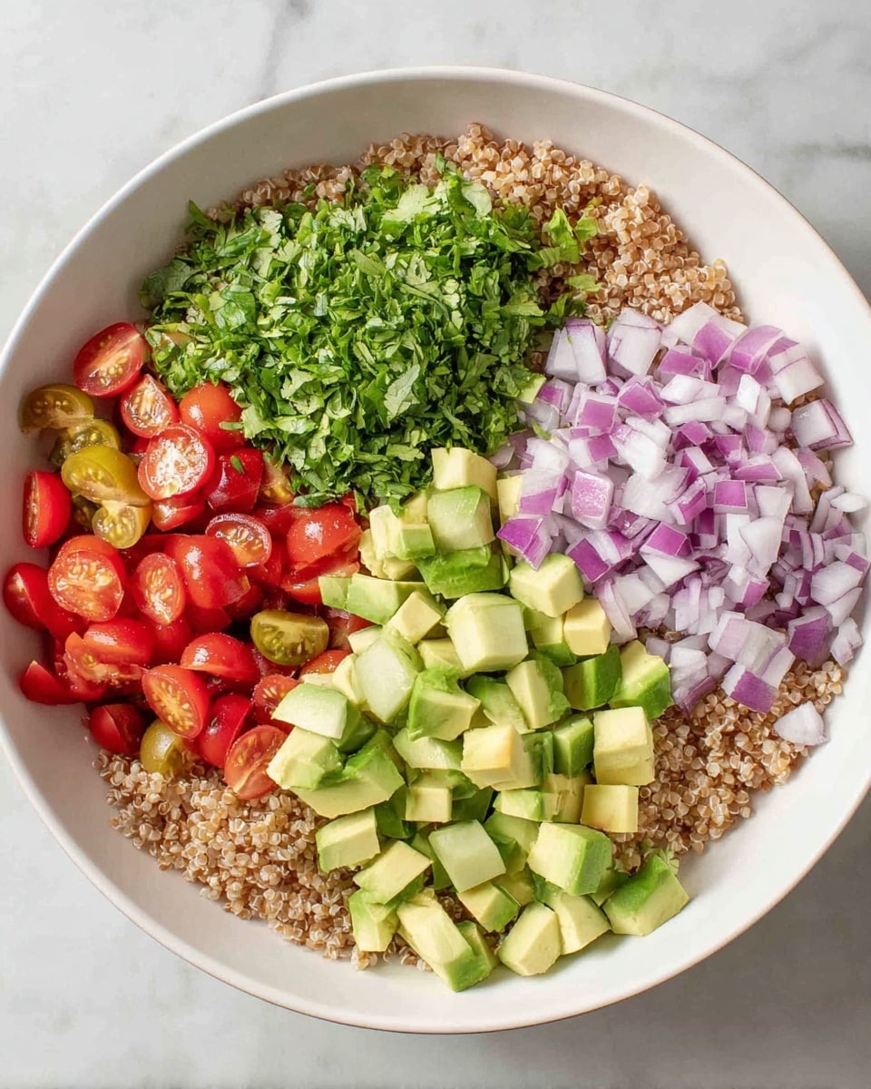 A large white bowl holds the dish, placed on a white marbled surface. The bottom layer is a bed of light brown cooked grains that cover the bowl's base evenly. On top, there are five clear sections of fresh chopped vegetables: bright green chopped cilantro on the left, next to small cubes of pale green avocado, then diced darker green cucumber, followed by small red cherry tomato halves, and finally finely chopped purple and white red onion. Each vegetable section is distinct and neatly arranged side by side, showing a colorful and fresh mix. Photo taken with an iphone --ar 4:5 --v 7