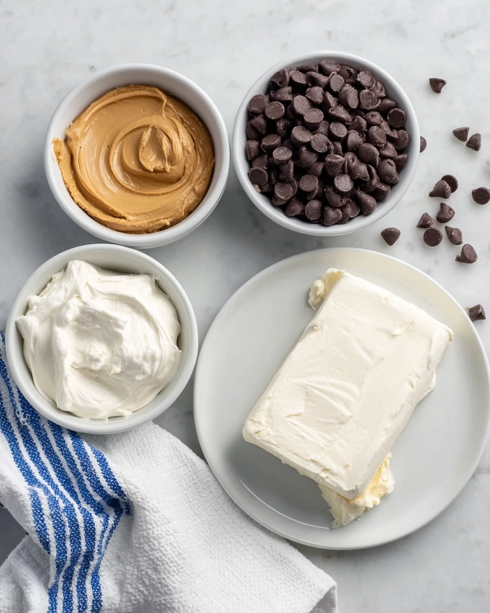 The image shows four small white bowls on a white marbled surface, each holding different ingredients. One bowl contains a smooth light brown peanut butter with swirled texture. Another bowl holds soft, white cream cheese spread, slightly uneven on top. A third bowl is filled with dark brown, shiny chocolate chips that have a firm, rounded shape. In the center foreground, a white plate has a block of smooth, creamy white cream cheese with a small peeled corner. To the right, a white cloth with blue stripes is partly visible. A few chocolate chips are scattered on the surface around the bowls. Photo taken with an iphone --ar 4:5 --v 7