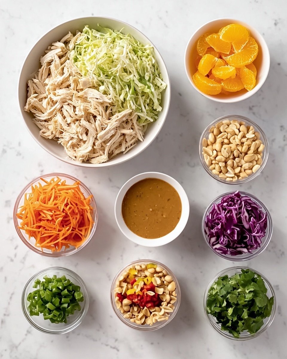 The image shows several small bowls of ingredients arranged neatly on a white marbled surface: a large white bowl in the center filled with shredded light beige chicken, a big white bowl above it filled with thinly shredded green and purple cabbage, a white bowl with bright orange mandarin slices to the upper right, and a smaller white bowl with green cilantro leaves to the lower right. Surrounding these are smaller clear bowls holding shredded orange carrot, sliced white almonds, roasted peanuts, chopped green onions, and diced red bell pepper. In the middle, there is a white bowl with smooth, thick, brown peanut sauce. The overall layout is clean and colorful, showing fresh, raw ingredients in separate containers. photo taken with an iphone --ar 4:5 --v 7
