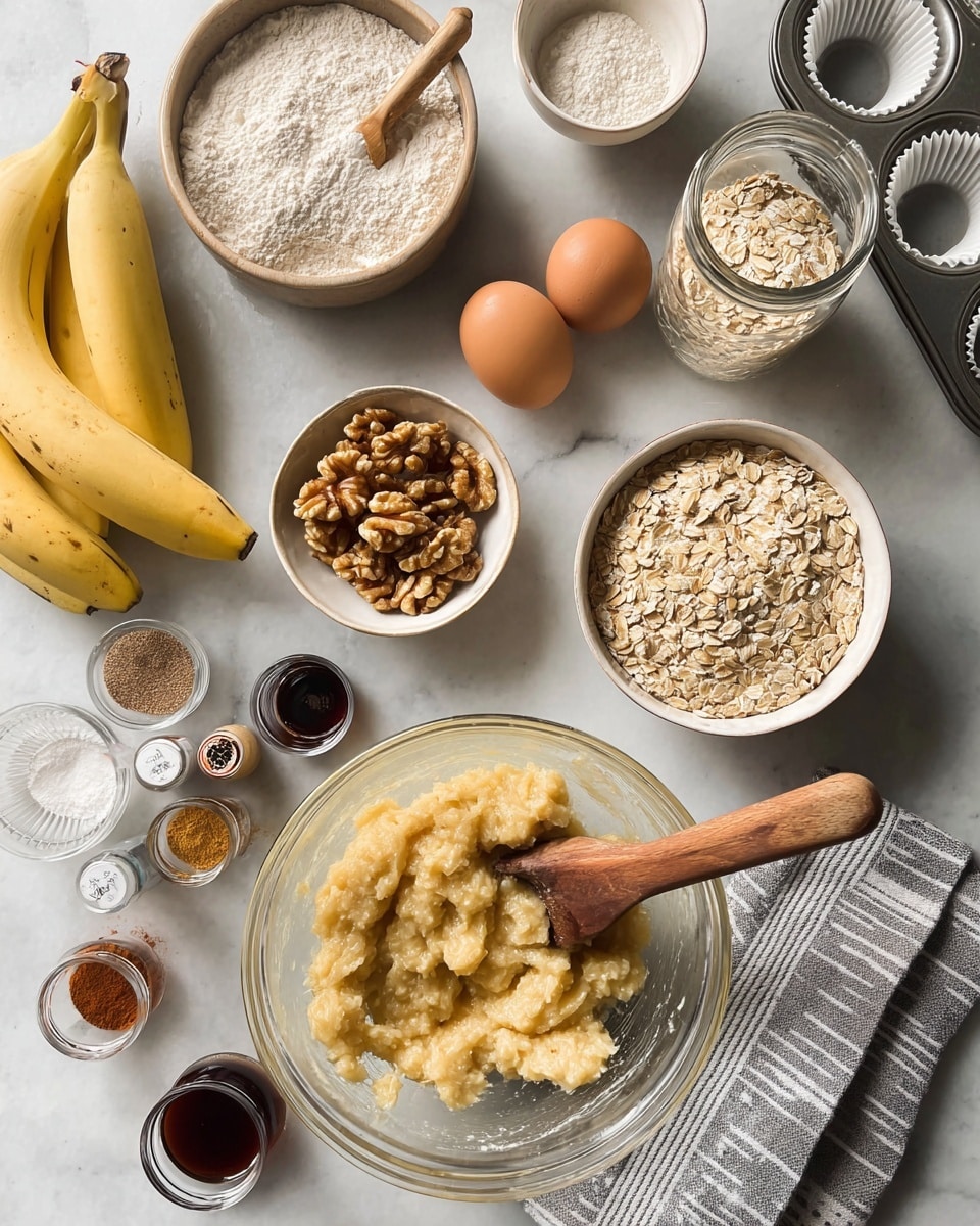 The image shows a white marble surface with baking ingredients arranged neatly: a large clear glass bowl at the bottom filled with mashed bananas being mashed by a utensil with a wooden handle; above it slightly to the right, a small white bowl filled with shelled walnuts; next to it, a glass jar filled with rolled oats with a metal scoop resting inside; to the left of the oats are two brown eggs placed side by side near a small glass container of dark liquid, a small bottle of vanilla extract, and two small spice jars with cinnamon and other spices; at the top left are two bowls with flour - one glass and one white - with wooden spoons; and to the far left, three whole bananas lay on the surface; a gray and white striped cloth napkin is placed near the bottom right; a metal muffin tray with empty white paper liners is partially seen at the top right. photo taken with an iphone --ar 4:5 --v 7