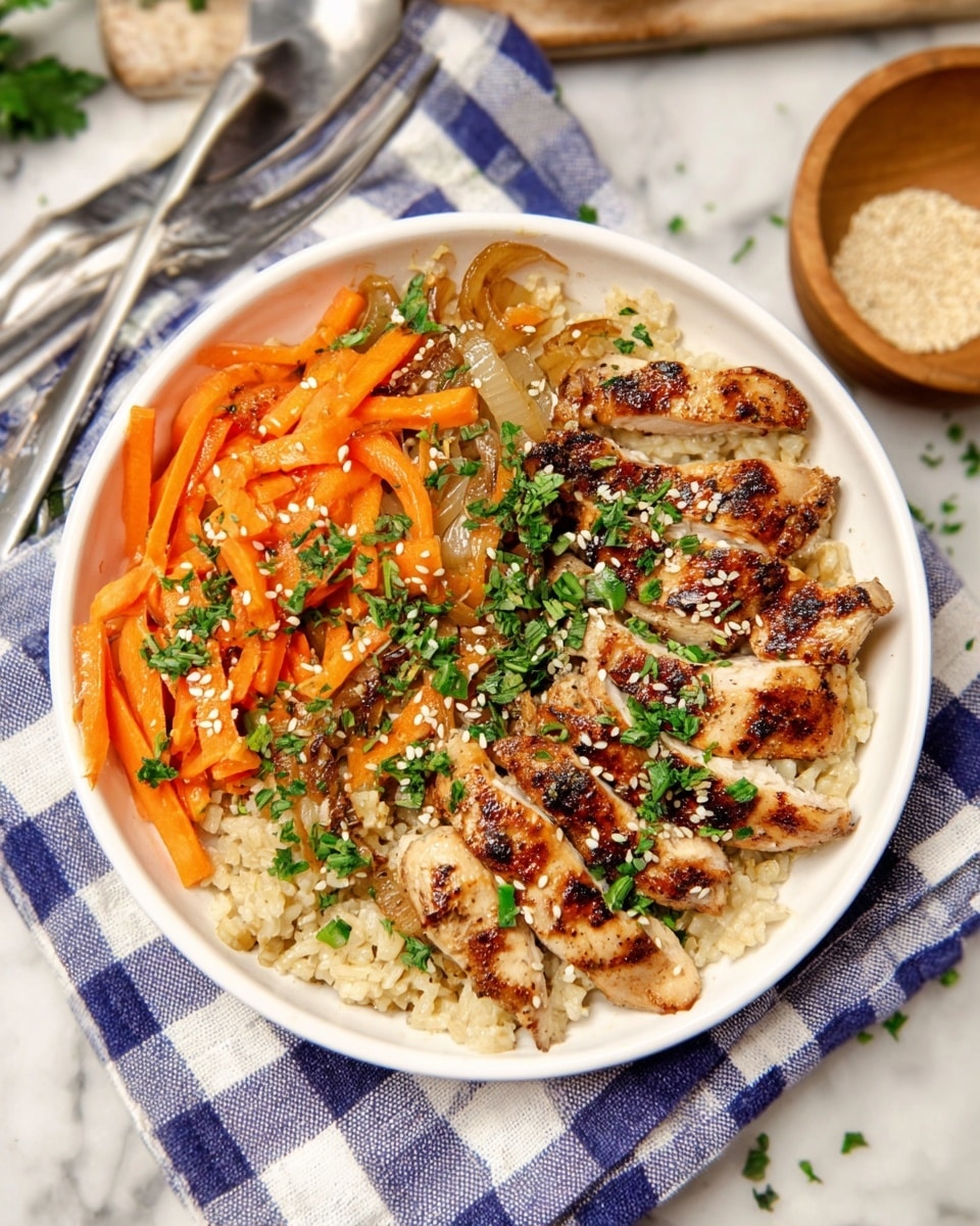 The image shows a white bowl with three main layers: at the bottom is a layer of light brown cooked rice with a soft texture, on one side there is a layer of orange carrot sticks mixed with some translucent sautéed onions, and on the other side, there are grilled, sliced pieces of golden-brown chicken with a slightly charred look. The dish is sprinkled with white sesame seeds and chopped green herbs on top. The bowl rests on a blue and white checkered cloth on a white marbled surface, with a silver fork partially visible behind it and a small wooden bowl with sesame seeds to the side. Photo taken with an iphone --ar 4:5 --v 7