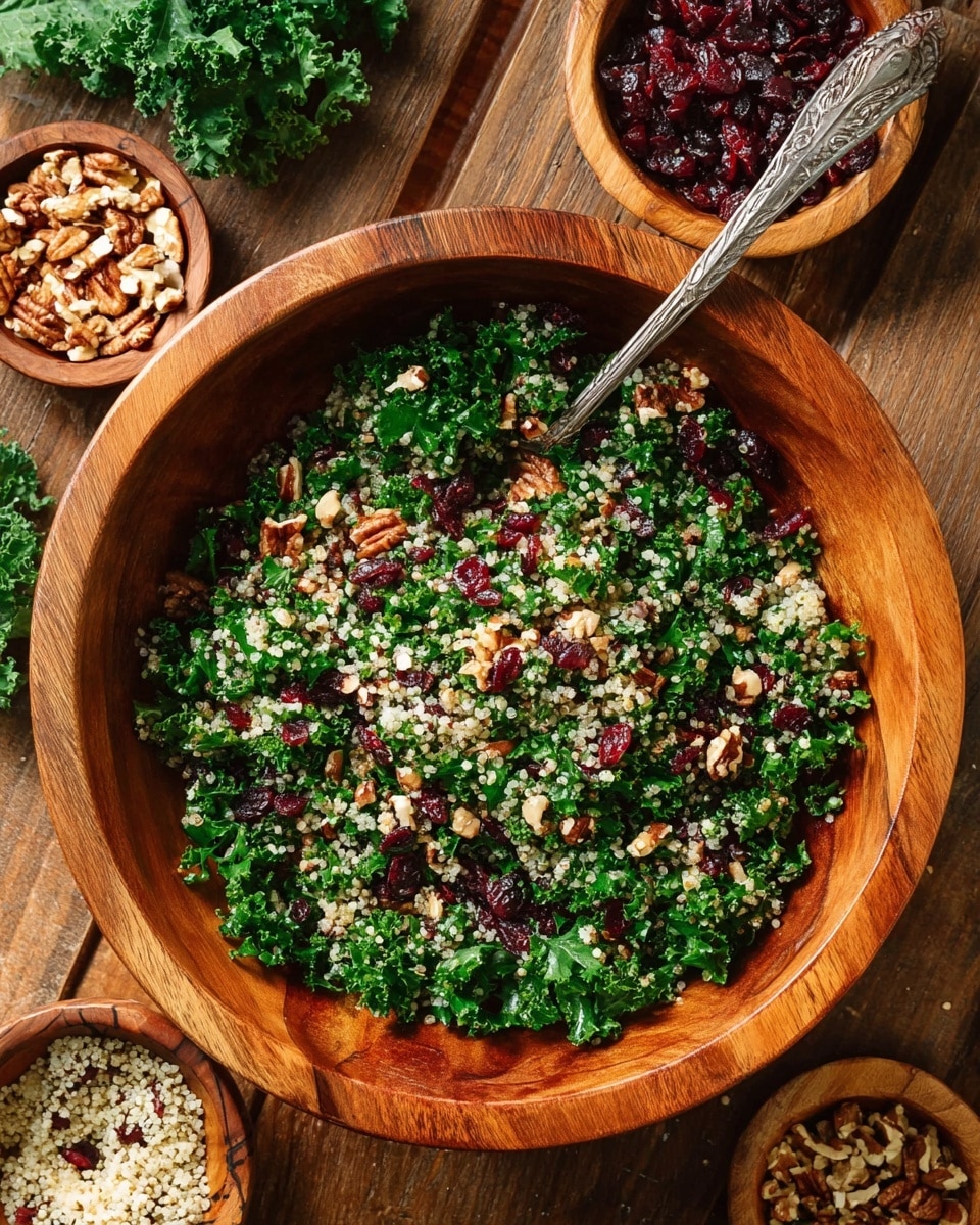 A large wooden bowl holds a colorful salad with three main layers mixed together: bright green kale leaves, small pale quinoa grains, and dark red dried cranberries scattered throughout. Small chopped nuts add a rough texture and light brown color evenly spread across the salad. A vintage silver spoon with intricate designs rests inside the bowl. Around the bowl, there are small wooden bowls filled with extra nuts, quinoa, and kale, all set on a wooden surface. The overall look is fresh and natural with rich green, white, red, and brown colors. Photo taken with an iphone --ar 4:5 --v 7