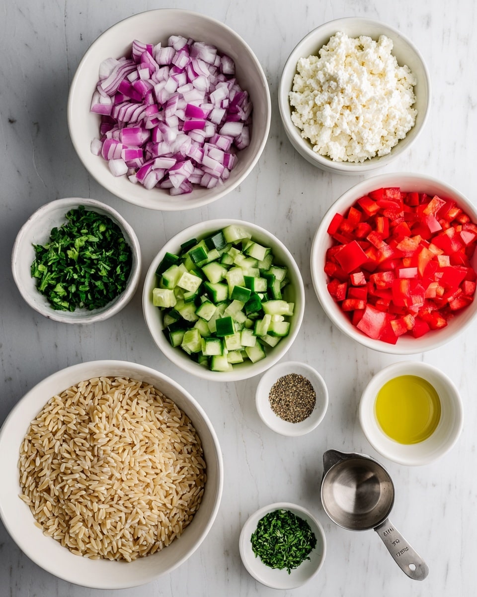 Several white bowls and small white containers are arranged on a white marbled surface. There are chopped red onions in one bowl, diced green cucumbers in another, chopped red bell peppers in a bowl below the onions, and small white crumbled cheese in a larger bowl nearby. A bowl below holds light brown orzo pasta. Small white containers hold chopped green herbs, ground black pepper, and a yellow liquid, which could be oil or vinegar. A metal measuring cup contains clear oil near the bottom right. The colors are bright with a mix of red, green, purple, white, and light brown shades. photo taken with an iphone --ar 4:5 --v 7