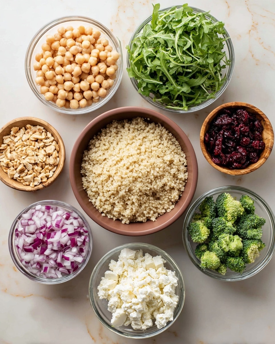 The image shows seven bowls of ingredients placed on a white marbled surface arranged in a circle with one bowl in the center. The center has a medium brown bowl filled with fluffy, light tan quinoa grains. Surrounding it, clockwise from top left, there is a clear glass bowl filled with beige chickpeas, another clear glass bowl filled with bright green arugula leaves, a small wooden bowl filled with finely chopped light tan nuts, a clear glass bowl filled with soft white cottage cheese, a clear glass bowl with diced purple and white red onions, a clear glass bowl containing dark red dried cranberries, and a small wooden bowl filled with small bright green broccoli florets. The overall look is colorful and fresh, with a clean and simple arrangement. Photo taken with an iphone --ar 4:5 --v 7