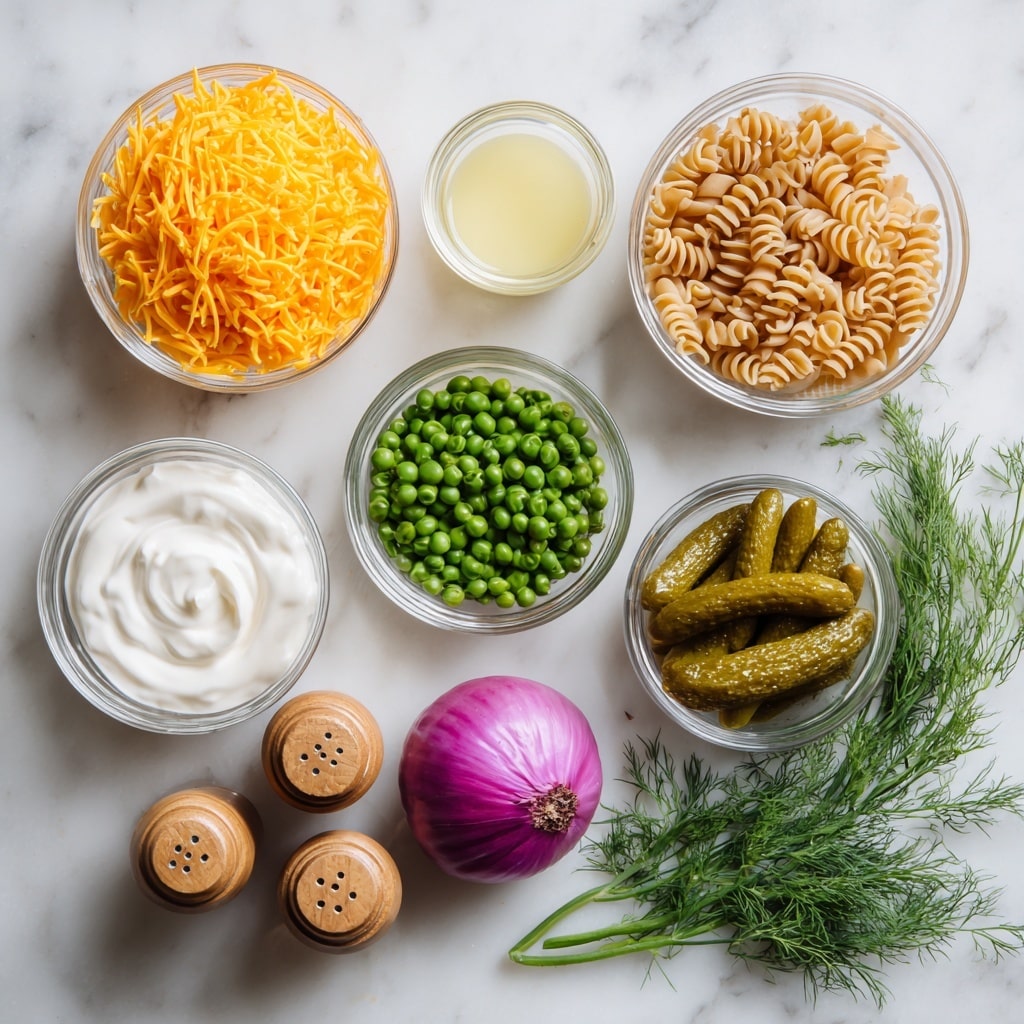 Seven small white bowls and one clear glass cup are arranged on a white marbled surface. The top left bowl holds bright orange shredded cheese, while the top right bowl is filled with red lentil pasta with a twisted shape. Beneath these is a clear glass cup containing pale yellow pickle juice. To the left center, a bowl contains smooth white mayo, and directly below it is a bowl with thick white yogurt. To the right of the yogurt is a bowl with several green pickles that have bumpy textures. Below the cheese is a bowl full of round, green peas. At the bottom center sits a small round purple onion, next to two wooden shakers labeled salt and pepper, and a bunch of fresh green dill with feathery leaves rests on the right side. Photo taken with an iphone --ar 4:5 --v 7