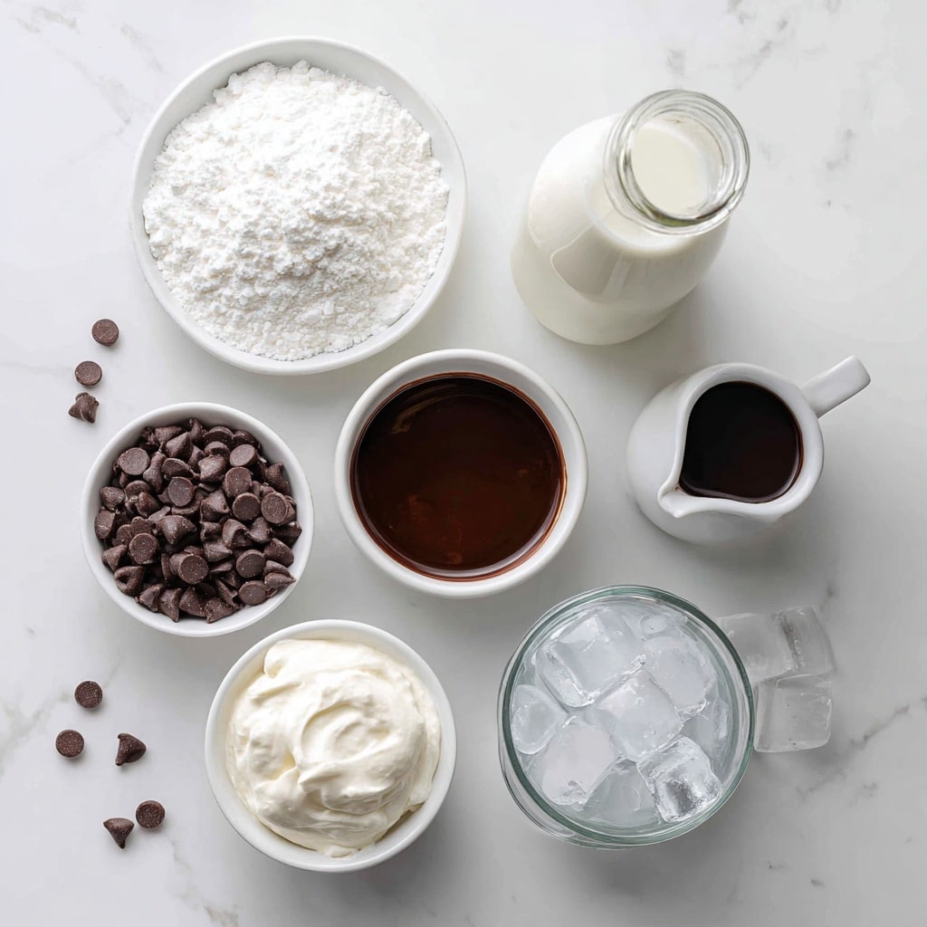 The image shows six white containers on a white marbled surface, each filled with different ingredients for a recipe. At the top left is a round bowl filled with ¼ cup white powdered sugar, textured finely. To the top right is a glass bottle filled with 1 cup of white milk. Below the milk bottle is a white small jug holding dark brown, shiny chocolate syrup, with a smooth texture and a small spout. To the bottom left is a white bowl full of small, dark brown mini chocolate chips with a matte finish. Near the center is a small white jar filled with thick white whipping cream with a smooth surface. At the bottom right is a glass pitcher filled with large, clear chunks of ice. Small scattered mini chocolate chips surround some of the containers. The text overlays show measurements and ingredient names in bold black with a handwritten style. The photo taken with an iphone --ar 4:5 --v 7