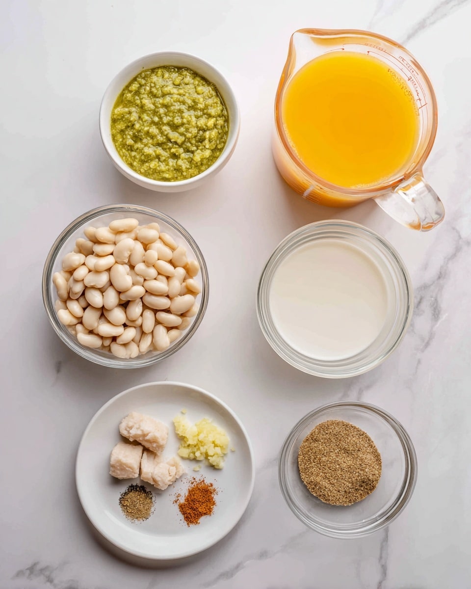 The image shows six containers of ingredients on a white marbled surface. At the top right is a clear glass measuring cup filled with orange-yellow liquid. Below it, another clear glass measuring cup contains a white creamy liquid. At the top left, a small white bowl holds a green sauce with a coarse texture. Below it, a clear glass bowl is filled with white beans. In the center is a small white bowl with pale chunks of cooked meat. At the bottom left, a white plate has two small piles: one of finely chopped light yellow garlic and another of brown ground spice. Photo taken with an iphone --ar 4:5 --v 7