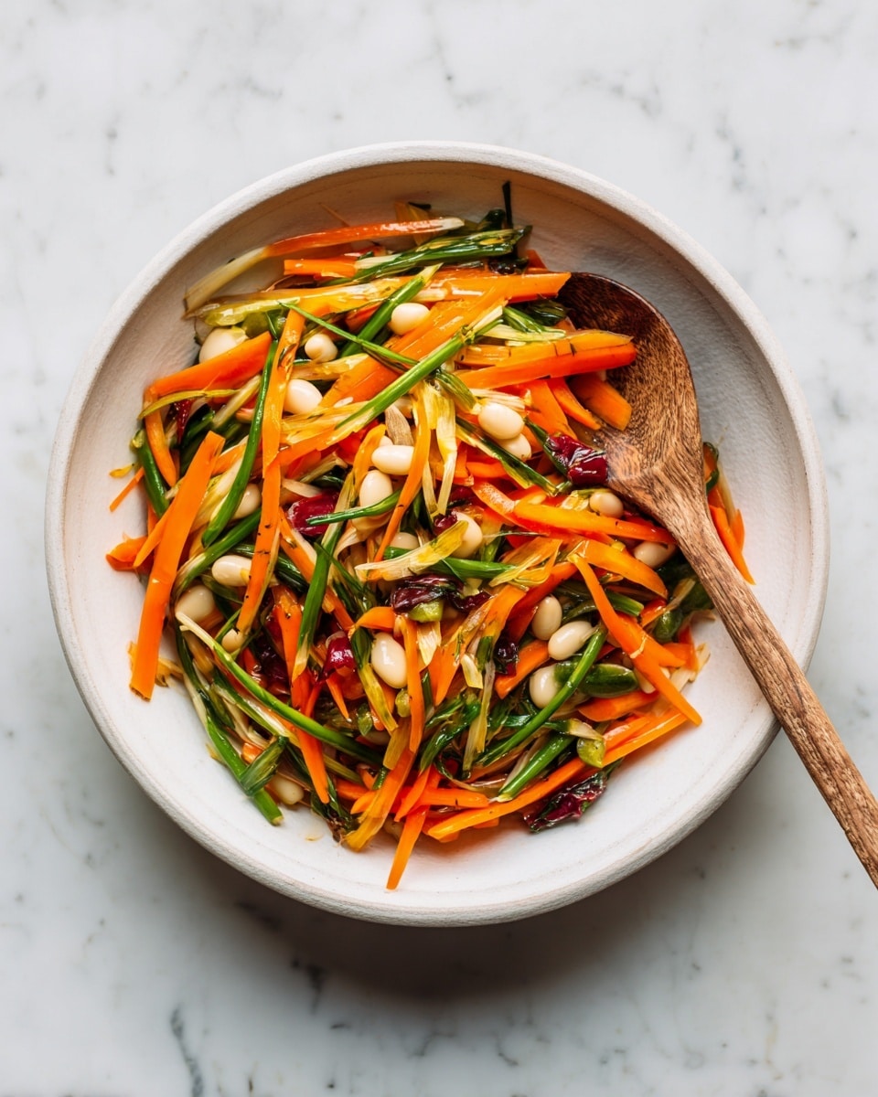 A wide white bowl sits on a white marbled surface holding a colorful mix of food. The dish has three main layers: bright orange carrot sticks cut thin and spread evenly throughout; long, thin green onion strips with white ends mixed closely in; and many small white beans scattered all over. There are also some dark, almost black chunks without a clear shape dotted in between the other ingredients. A natural wood spoon rests inside the bowl, partially covered by the mix. The whole scene looks fresh and colorful. photo taken with an iphone --ar 4:5 --v 7
