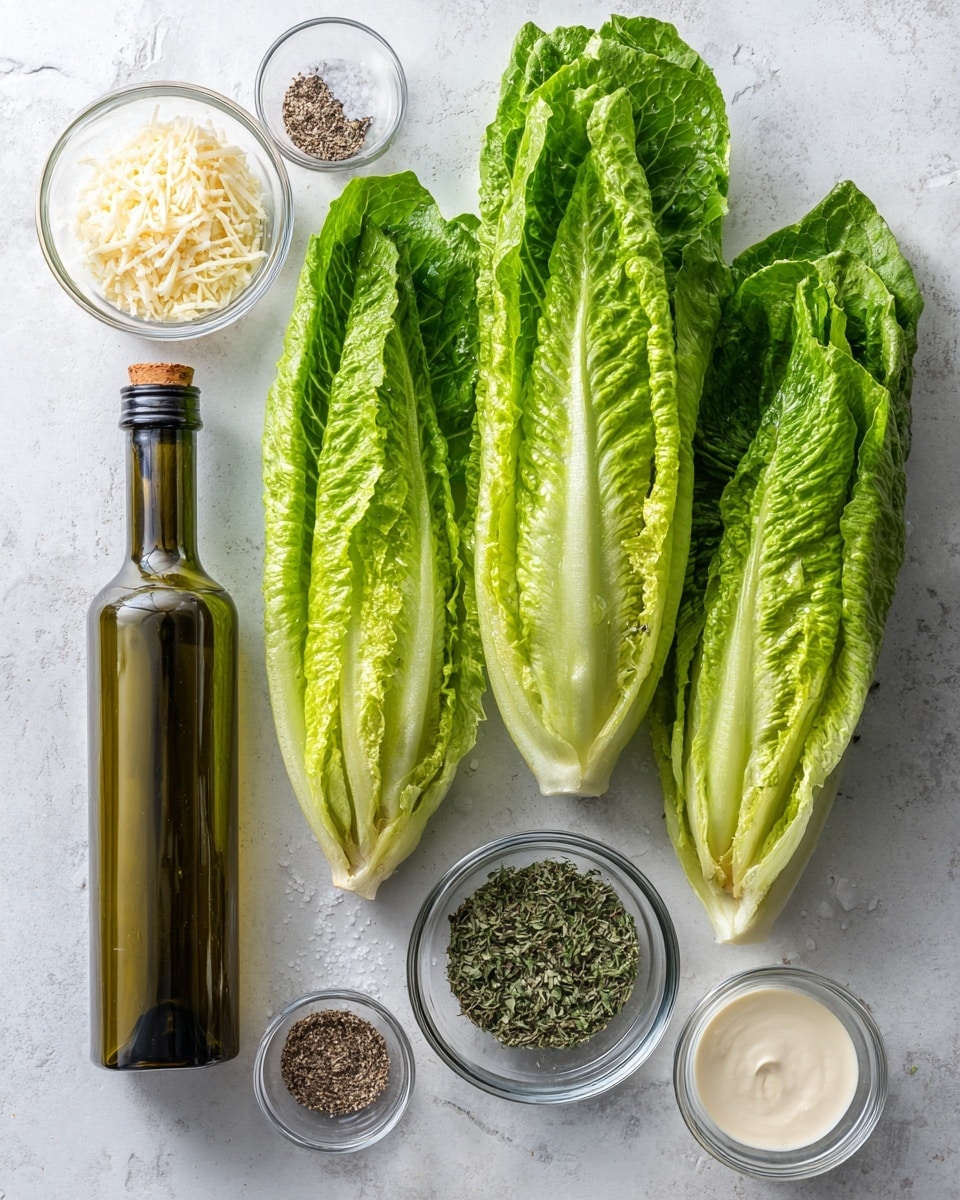 The image shows fresh, bright green romaine lettuce cut into three long halves placed side by side with visible ribbed textures on the leaves. Below the lettuce, a dark green bottle of California Extra Virgin Olive Oil stands upright. Next to the bottle, five small clear glass bowls are arranged in two rows; the top row has a bowl filled with light beige grated parmesan cheese and a bowl of green mixed dried herbs. The bottom row contains a bowl with white shredded cheese, a bowl with black pepper and salt, and a bowl with creamy white dressing. All items are set on a white marbled surface. photo taken with an iphone --ar 4:5 --v 7