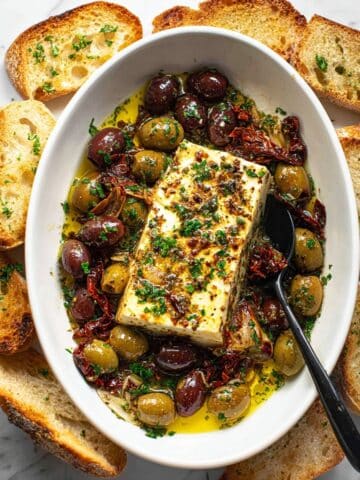 Baked Feta with Olives, Sun-Dried Tomatoes, and Herbs Recipe