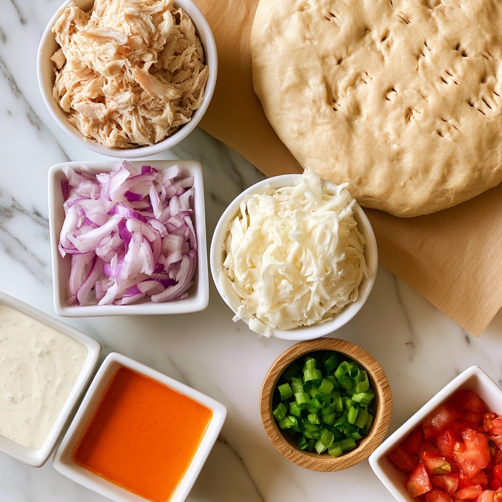 A round pizza dough with a light beige color and small fork holes is placed on brown parchment paper in the top right corner. Surrounding it are small white bowls and containers, each with different ingredients: shredded pale beige chicken in a white bowl at the top left, thin slices of purple and white red onion in a square white bowl below it, soft white shredded mozzarella cheese in a white bowl to the right, bright green chopped scallions in a small wooden bowl below the cheese, and small red tomato pieces in a square white bowl at the bottom right. Two white square bowls hold creamy white ranch dressing and bright orange buffalo sauce in the lower left corner. All items rest on a smooth white marbled surface with gentle gray veins. photo taken with an iphone --ar 4:5 --v 7