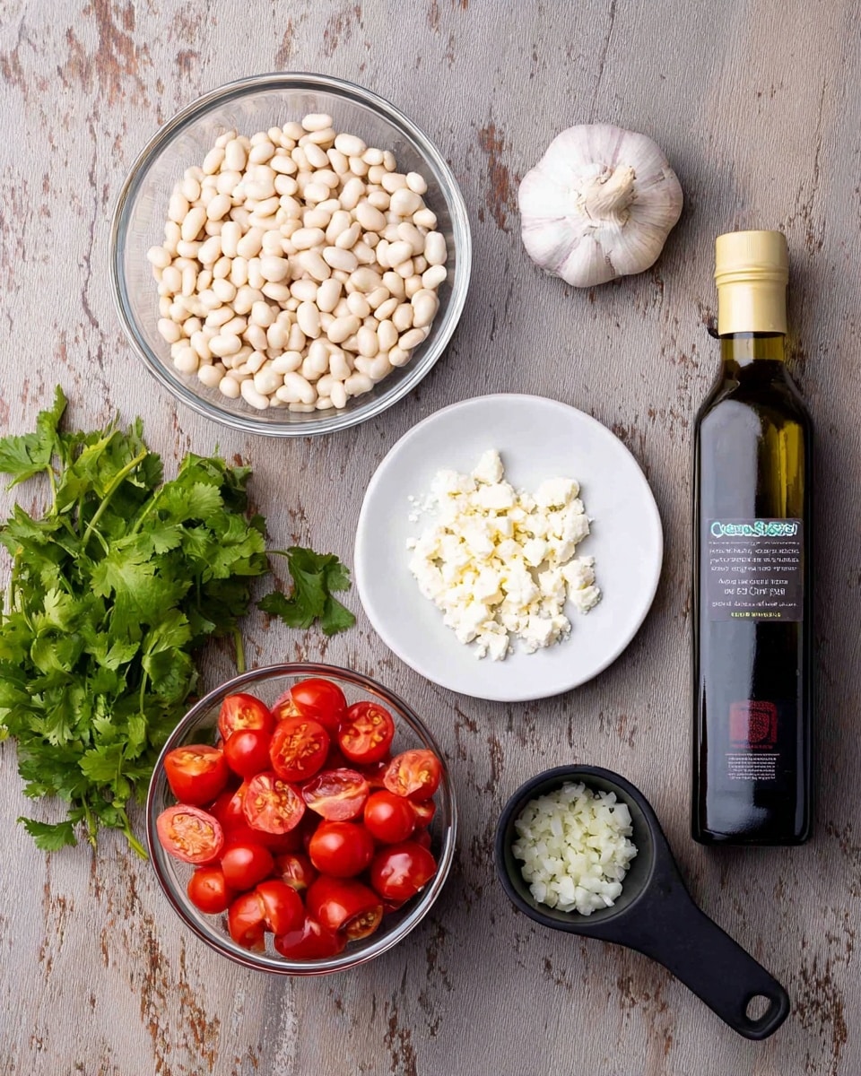 The image shows six main ingredients arranged on a white marbled surface: at the top center, a clear glass bowl filled with small white beans, their texture smooth and round; to its right, a small white plate with crumbly white cheese pieces; below the beans, a clear glass bowl holds halved cherry tomatoes, bright red with juicy interiors visible; to the right of the tomatoes, a black measuring cup filled with finely chopped white onions; next to the cup, a dark bottle of extra virgin olive oil with a golden cap and a label featuring blue and green colors stands upright; on the far left, fresh green cilantro leaves and a bulb of garlic rest loosely, adding a natural touch of green and white to the arrangement. photo taken with an iphone --ar 4:5 --v 7