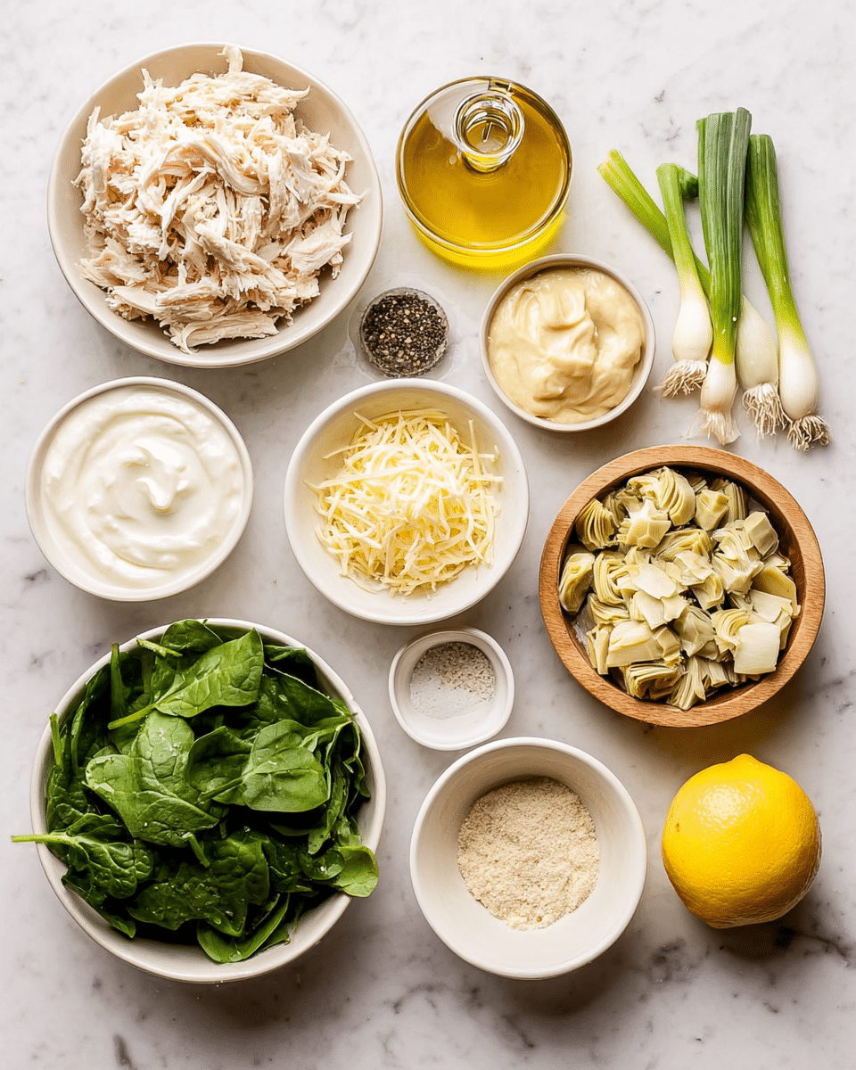 The image shows a top view of several small white bowls, each filled with different ingredients, all placed on a white marbled surface. There is one bowl with shredded pale off-white cooked chicken on the left, next to a small dark-edged white bowl filled with thick white sour cream. Above the chicken, there's a round glass bottle of golden yellow olive oil. To the right of the chicken bowl, there is a wooden bowl filled with fine pale yellow shredded cheese. Below it is a small white bowl with a creamy white sauce or mayonnaise. Next to it and slightly below, a small white bowl contains light beige garlic powder. To the right, a larger white bowl is filled with chopped artichoke pieces that are pale green and beige. Above the artichoke bowl is a white bowl full of fresh dark green spinach leaves. Above the spinach, a small white plate holds a mix of black and white ground pepper and salt. On the far right of the arrangement, a fresh lemon cut in half shows bright yellow flesh. Beside the lemon are fresh green onions with white stalks and vibrant green tops. Everything is arranged neatly, showing fresh and mixed textures. Photo taken with an iphone --ar 4:5 --v 7