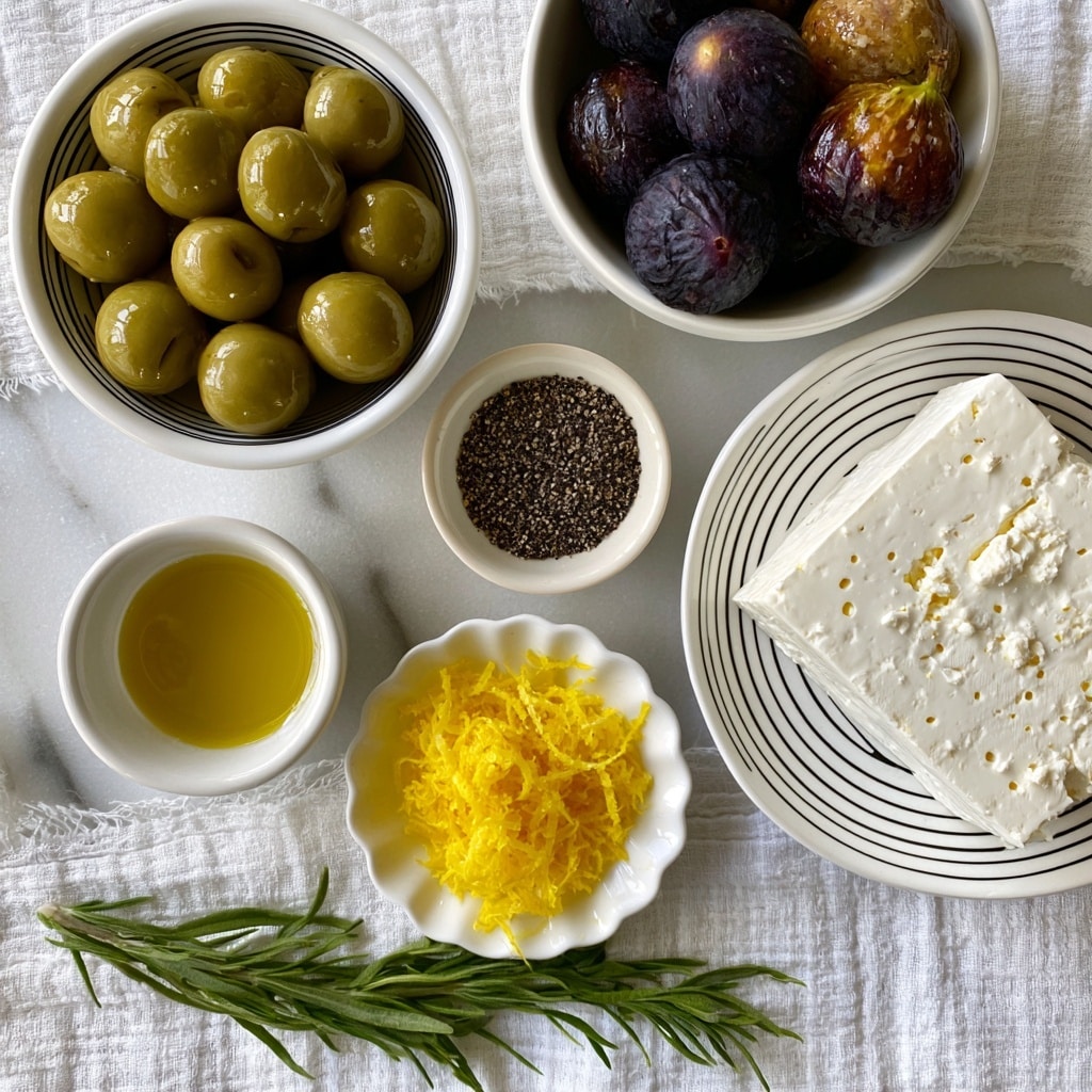 A flat lay of various food items arranged on a white marbled background with a textured white cloth underneath. In the top left, a white bowl with black stripes holds round, green Castelvetrano olives with a shiny surface. To the right, a white bowl contains dark purple and brown figs with a matte texture. Below the olives and figs, a small white bowl with a smooth surface has golden olive oil. Next to it, another small white bowl is filled with finely ground black pepper. In the center bottom, a scalloped white dish holds bright yellow lemon zest strands. On the right side, a white plate with black stripes features a large square block of white feta cheese with crumbles and small holes. At the bottom, a fresh green tarragon sprig lies diagonally across the cloth. The overall light is soft and natural. photo taken with an iphone --ar 4:5 --v 7