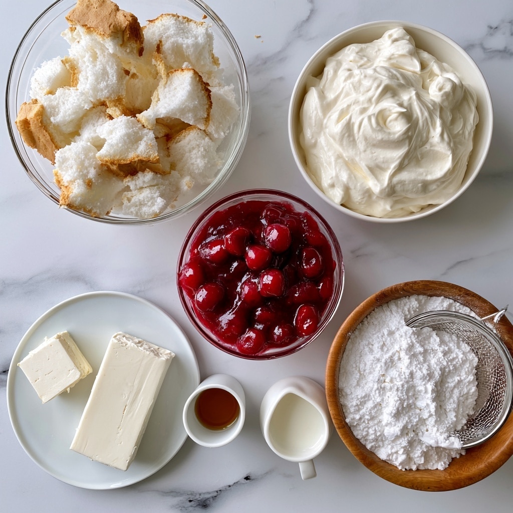 The image shows seven ingredients arranged on a white marbled surface. At the top left in a clear glass bowl are torn pieces of angel food cake, white with light brown edges. To the right in a white bowl is a smooth, creamy white whipped topping. Below the whipped topping, in a clear bowl, is shiny red cherry pie filling with whole cherries visible. On the lower left, a white plate holds two blocks of cream cheese, one smaller square and one larger rectangle, both smooth and white. Next to the plate is a small white cup with a light brown vanilla extract. To the right, a wooden bowl is filled with white powdered sugar, and inside it is a metal sifter. Lastly, a small white pitcher with milk is placed near the cherry pie filling. photo taken with an iphone --ar 4:5 --v 7