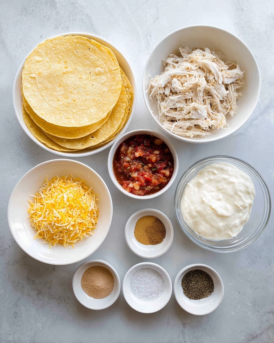 Several small white bowls and one glass bowl are arranged on a white marbled surface. The largest white bowl holds a stack of round yellow corn tortillas with a soft, slightly uneven texture. Another large white bowl contains shredded white chicken with a fibrous and moist look. A white bowl next to it has two layers of shredded cheese, one bright yellow and one white, loosely mixed together. In the center, a smaller white bowl holds a chunky tomato-based salsa with visible pieces of tomatoes, onions, and herbs. Surrounding these are four small white bowls with different powders and spices in various colors: light brown, dark brown, beige, and white salt crystals. There is also a glass bowl filled with thick, white sour cream with a smooth, creamy texture. The whole setup evokes a fresh and colorful preparation for Mexican-style food. photo taken with an iphone --ar 4:5 --v 7