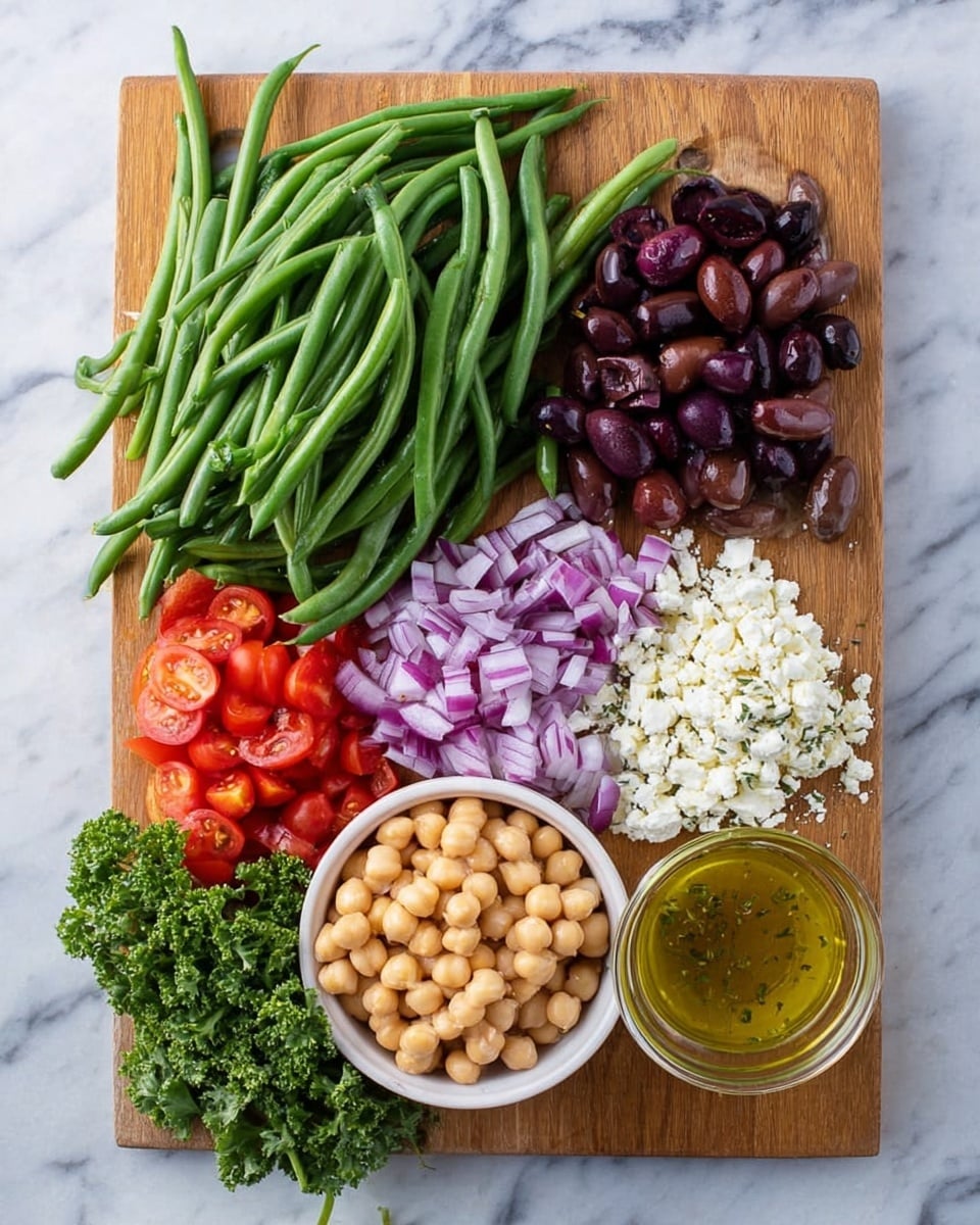 A wooden cutting board holds a colorful arrangement of salad ingredients placed on a white marbled surface. At the top left, a large pile of fresh green beans lay in long, smooth, bright green clusters. To the right of the beans, there is a small pile of dark purple, sliced olives with a glossy texture. In the center-right, a small heap of white, crumbly feta cheese sits next to a small glass bowl filled with a light golden salad dressing that has herbs floating in it. Below the cheese, finely chopped purple onions are scattered in a neat pile. At the bottom center of the board, a small white bowl overflows with light beige-colored chickpeas. To the left of the chickpeas, bright red grape tomatoes are halved and piled together. At the bottom left corner, a small bunch of fresh curly green parsley adds contrast to the composition. The photo taken with an iphone --ar 4:5 --v 7