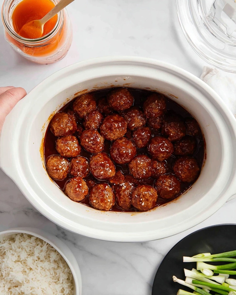 A white slow cooker filled with two layers of glazed meatballs, each meatball has a shiny, rich brown color with a sticky sauce coating. The slow cooker is placed on a white marbled surface. At the top left, there is a glass jar with an orange sauce and a woman’s hand holding a stirrer inside it. At the bottom left, there is a white bowl full of cooked white rice. At the top right, a black plate holds sliced green onions, arranged neatly in a pile. Photo taken with an iphone --ar 4:5 --v 7