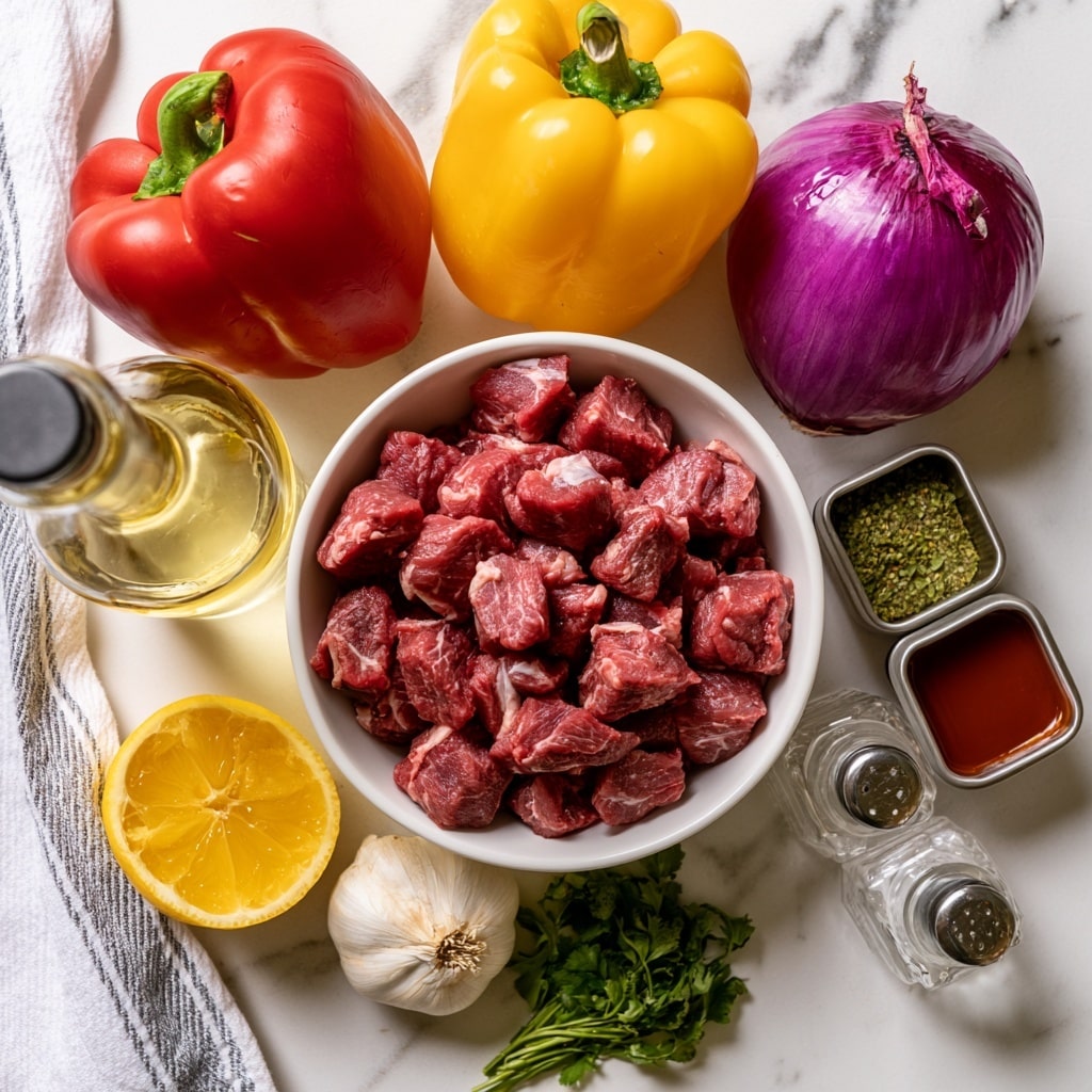 The image shows an arrangement of fresh ingredients on a white marbled surface. At the center is a white bowl filled with small cubes of raw lamb meat, which are red with white marbling. Above the bowl, there are three whole vegetables: a red bell pepper on the left, a yellow bell pepper in the middle, and a purple onion on the right. To the left of the bowl, there is a bottle of light yellow vegetable oil and half a lemon showing its bright yellow juicy interior. Below the bowl, there is a whole bulb of garlic and a small bunch of fresh green herbs. To the right, two square metal containers hold green seasoning and Worcestershire sauce, and there are two clear salt and pepper shakers nearby. A white and gray striped cloth is partially visible on the left side. The photo is taken with an iphone --ar 4:5 --v 7