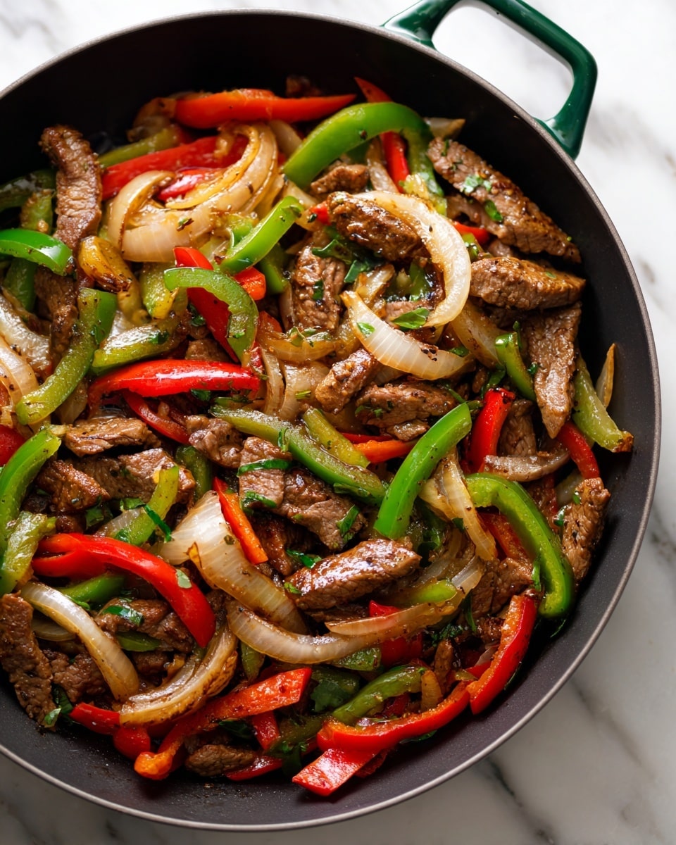 A close-up view of a black skillet with a green handle, placed on a white marbled surface, filled with cooked beef strips piled on top and surrounded by cooked slices of red and green bell peppers and light brown onion strips, showing a mix of glossy and soft textures. Photo taken with an iphone --ar 4:5 --v 7