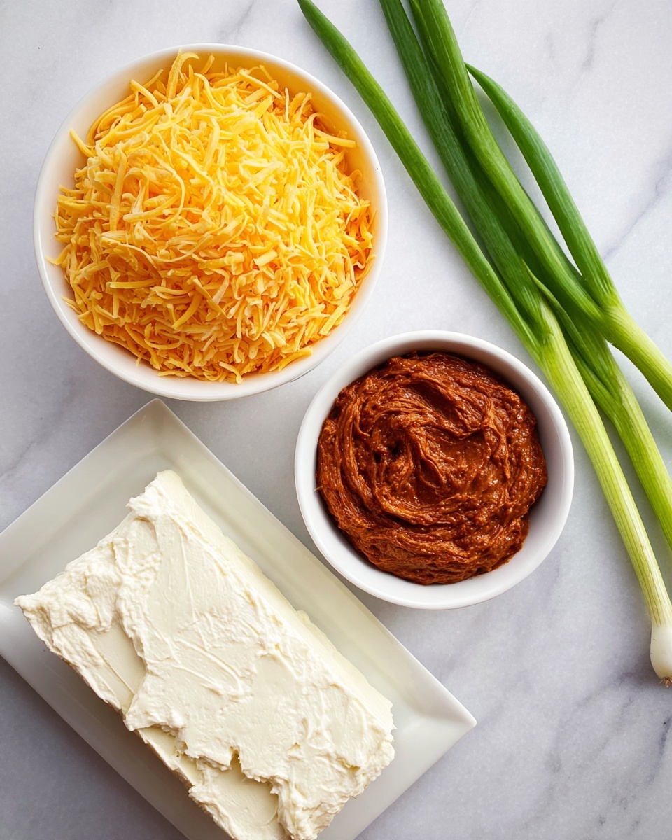 The image shows three white bowls and a white rectangular plate on a white marbled surface. The top bowl is filled with shredded bright yellow-orange cheese, piled high in fine strands. The bowl on the lower right contains a thick, rich reddish-brown sauce or dip with a slightly chunky texture and swirled surface. The rectangular plate on the lower left holds a block of smooth, white cream cheese with a spreadable texture and some rough edges. On the right side, there are three long, fresh green onion stalks placed diagonally. Photo taken with an iphone --ar 4:5 --v 7