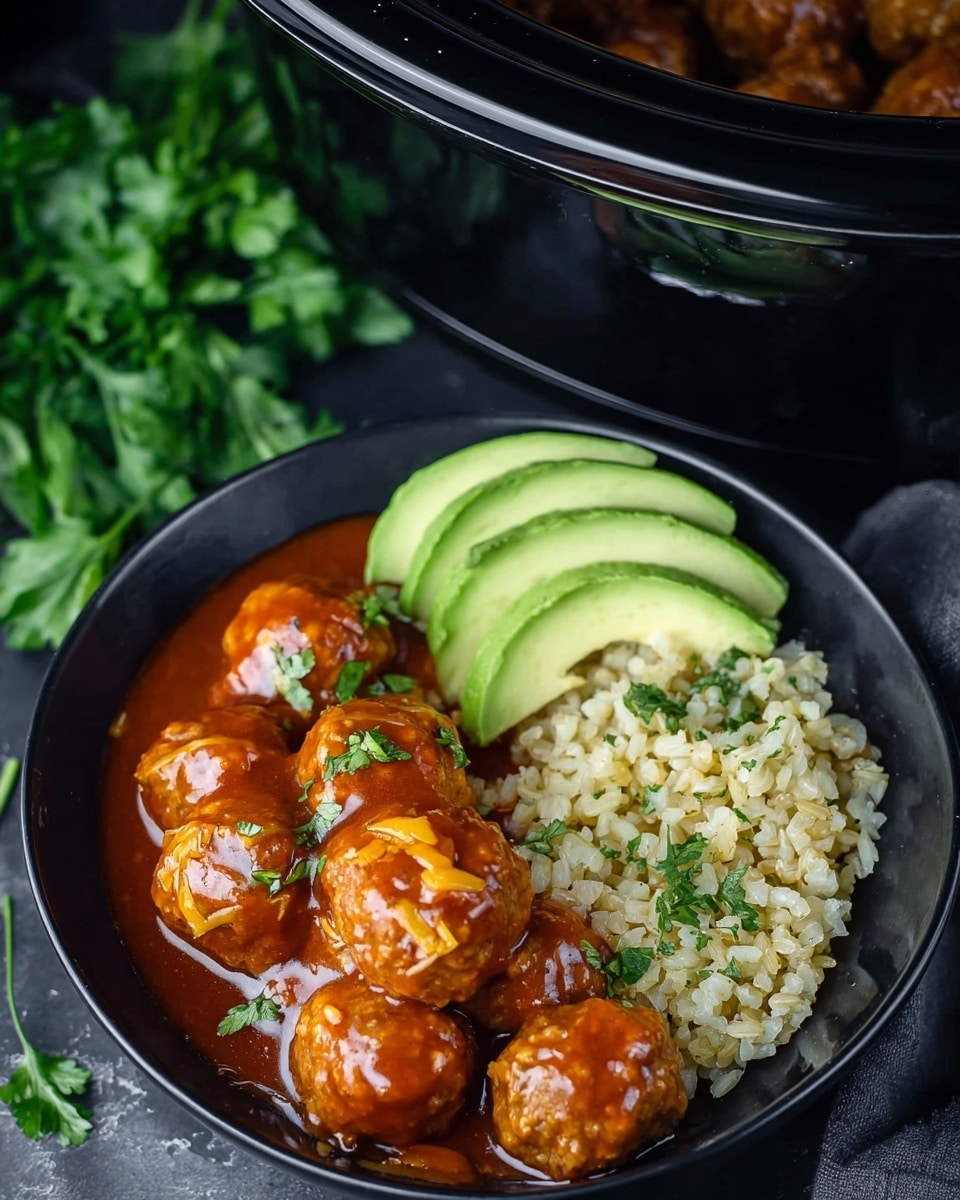 A black bowl holds a dish with three main layers arranged side by side: on the left, several slices of light green avocado with smooth texture. The middle layer has round meatballs covered in shiny, thick reddish-orange sauce with some melted cheese on top. On the right side, there is a portion of brown rice mixed with small green herbs, looking soft and fluffy. The bowl is placed on a dark surface with a hint of fresh green parsley nearby and part of a black slow cooker visible above, showing some meatballs inside. Photo taken with an iphone --ar 4:5 --v 7