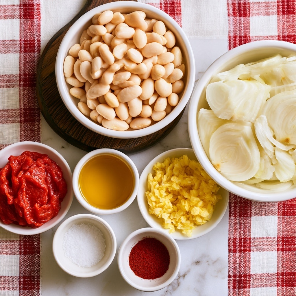 A top-down view of several white bowls arranged on a white marbled surface covered with a red and white checkered cloth. The largest bowl holds pale sliced onions on the right. Above it, a medium white bowl is filled with pale beige white beans, resting on a round dark wooden board. Below, smaller white bowls contain bright red tomato paste, golden yellow bean liquid, light yellow oil, and bright yellow minced garlic. Two more small white bowls hold white salt and deep red paprika powder. Each ingredient is clearly separated, showing distinct colors and textures, with a clean and bright presentation photo taken with an iphone --ar 4:5 --v 7