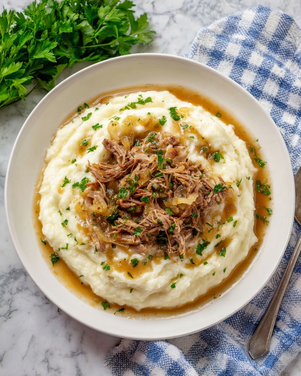 The image shows a close-up of a plate with a layered dish. The bottom layer is smooth and creamy mashed potatoes in light beige color. On top of that, there are shredded brown cooked beef pieces with a slightly wet texture. Mixed with the beef are thin, translucent cooked onion slices in pale yellow. A silver fork is picking up a bit of the mashed potatoes and onions from the right side. The plate is white and the surface underneath is a white marbled texture. The focus is on the center with a soft blurred background. Photo taken with an iphone --ar 4:5 --v 7