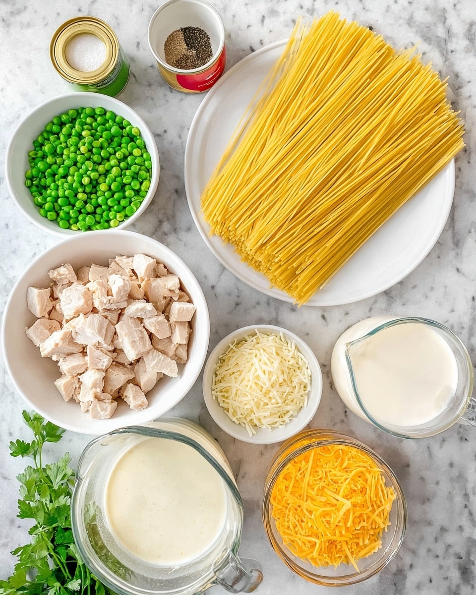The image shows the ingredients neatly arranged on a white marbled surface. There is a white plate holding a large pile of uncooked yellow spaghetti strands laid out flat. Next to it is a white bowl filled with light brown chunks of cooked chicken. A small white bowl contains bright green frozen peas, while another white bowl holds a mix of black pepper and salt. A clear glass bowl is filled with shredded white mozzarella cheese, and a small white bowl contains shredded orange cheddar cheese. A clear glass measuring cup holds white milk, and two small open cans reveal creamy yellow and beige sauces respectively. A white bowl is full of a thick white sauce, and a bunch of fresh green parsley is placed nearby. Photo taken with an iphone --ar 4:5 --v 7