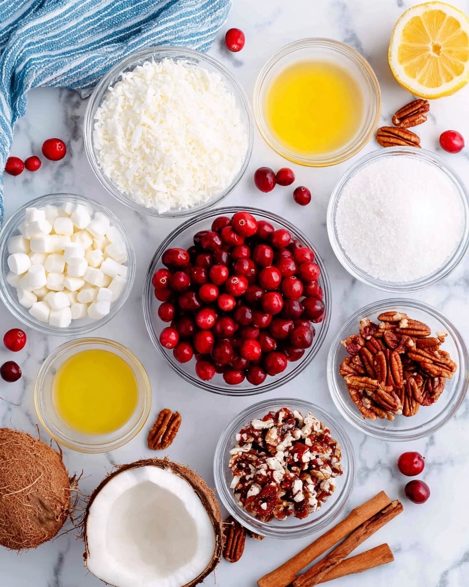 The image shows various clear glass bowls arranged on a white marbled surface, each filled with different ingredients. In the center is a bowl full of bright red cranberries, with a smaller bowl of cranberries to the side. Surrounding the center are bowls containing white shredded coconut, white mini marshmallows, crushed pecans with a deep brown color, white sugar, and a pale yellow liquid, likely melted butter or oil. A halved lemon with a light yellow interior and some red cranberries on it is near the top right. A cinnamon stick and some whole pecans are scattered around the bowls, along with half a coconut shell showing its white interior. The setting includes a blue and white striped cloth on the left side. Photo taken with an iphone --ar 4:5 --v 7