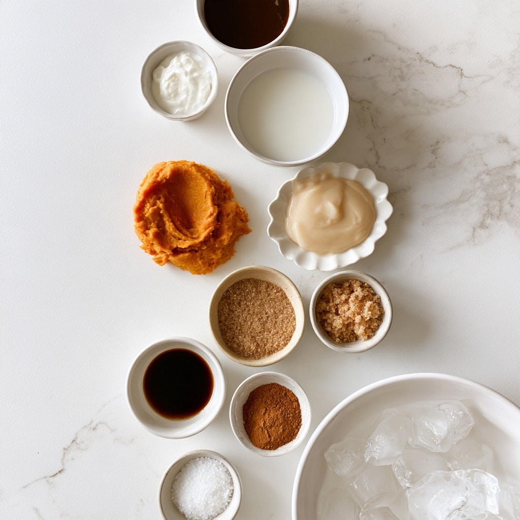 A white marbled surface holds several small white bowls and dishes arranged in a loose vertical line, each containing different ingredients for a recipe: a dark brown liquid labeled chilled espresso is in the top small bowl; below it is white heavy cream in a tiny bowl; next to that, a larger bowl contains whole milk, white in color; below the cream is a scoop of bright orange pumpkin puree resting directly on the surface; nearby is a white scalloped dish filled with pale beige sweetened condensed milk; next to it is a small bowl filled with light brown granulated brown sugar; below and slightly to the left is a small bowl with dark brown vanilla extract; next to that is a small white bowl with a light brown pumpkin pie spice powder; finally, at the bottom, two tiny bowls hold white salt and clear ice cubes respectively, the ice cubes are in a larger white bowl to the right. The background is clean, bright, and minimal with a white marbled texture. photo taken with an iphone --ar 4:5 --v 7