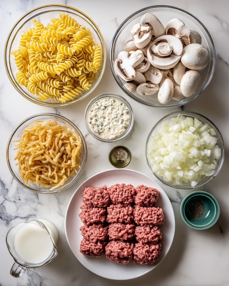 A wooden table holds a clear glass bowl filled with many yellow spiral pasta pieces on the top left, next to a white bowl full of chopped white onions on the top right. Below the onions, a clear glass bowl contains sliced white mushrooms with brown gills. In the center, a small clear glass bowl has a creamy white sauce with specks. Below that, a small green bowl holds a dark liquid, and next to it, a tiny clear bowl contains minced garlic. At the bottom center, a large white plate is piled with raw ground meat shaped in rows. To the left of the meat, a white bowl is filled with crispy fried onions. On the left side, near the pasta, a glass measuring cup holds milk. The scene is set on a white marbled surface. photo taken with an iphone --ar 4:5 --v 7